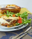 Traditional Greek dish with aubergines,potatoes,minced meat baked in white sauce with cheese Royalty Free Stock Photo