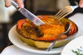 Traditional Greek dish, moussaka, eating with cutlery Royalty Free Stock Photo