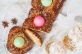 Traditional Greek Easter bread - tsoureki, sliced in Easter decoration with painted eggs and flowers. Top view Royalty Free Stock Photo