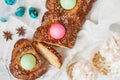 Traditional Greek Easter bread - tsoureki, sliced in Easter decoration with painted eggs and flowers. Top view Royalty Free Stock Photo