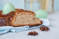 Traditional Greek Easter bread - tsoureki, sliced in Easter decoration with painted eggs and flowers. Royalty Free Stock Photo