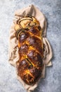 Traditional Greek Easter bread - tsoureki sliced . Sweet marbled brioche plait with nuts and chocolate Royalty Free Stock Photo