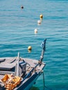 Traditional greek fishing boat with Greek Flag in Limenas Port, Thasos Island