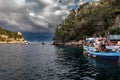 Traditional Greek fishing boats at harbor of Portofino town, Italy Royalty Free Stock Photo