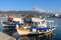 Traditional Greek fishing boats near pier of Sitia town on Crete island Royalty Free Stock Photo