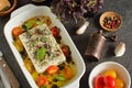 Traditional Greek food with baked feta cheese and summer vegetables