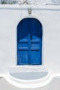 Traditional Greek Home on Santorini with blue door Royalty Free Stock Photo