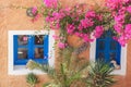 Traditional greek house with flowers in Oia village on Santorini island, Greece Royalty Free Stock Photo