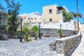 Traditional Greek house with mauve bougainvillea flowers