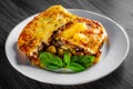 Traditional greek moussaka in white plate