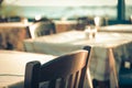 Traditional greek outdoor restaurant on terrace overlooking Mediterranean sea (Greece ). empty table at an street sea Royalty Free Stock Photo