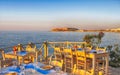 traditional greek outdoor restaurant on terrace at street village restaurant, Crete, Greece.