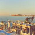 traditional greek outdoor restaurant on terrace at street village restaurant, Crete, Greece. Royalty Free Stock Photo