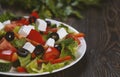 Traditional greek salad with fresh vegetables, feta cheese, black olives, ingredients for cooking Royalty Free Stock Photo