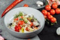 Traditional greek salad with fresh vegetables, feta cheese and olives. Top view. Selective focus Royalty Free Stock Photo