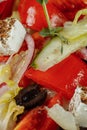 Traditional greek salad with fresh vegetables, feta cheese and olives. Top view. Selective focus Royalty Free Stock Photo