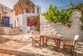 Traditional Greek street in town centre at sunset time, Amorgos Island, Greece. Royalty Free Stock Photo