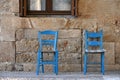 Traditional Greek taverna blue chairs Royalty Free Stock Photo