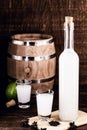 Traditional Greek vodka, known as Uzo or ouzo in shot glasses on a rustic wooden background. Space for text Royalty Free Stock Photo