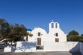 Traditional Greek white church arch with cross and bells in village Oia of Cyclades Island Santorini Greece Royalty Free Stock Photo