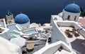 Traditional Greek white church arch with cross and bells in village Oia of Cyclades Island Santorini Greece Royalty Free Stock Photo