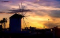 Traditional Greek windmill by the sea at dusk