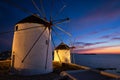 Traditional greek windmills on Mykonos island at sunrise, Cyclades, Greece Royalty Free Stock Photo