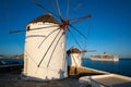 Traditional greek windmills on Mykonos island at sunrise, Cyclades, Greece Royalty Free Stock Photo