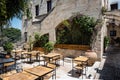 Traditional Greek yard with empty tables in tavern on Rhodes island