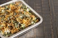 Traditional Green Bean Casserole with Fried Onions on a Wooden Table Royalty Free Stock Photo