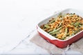 A traditional green bean casserole topped with French Fried Onions and cream of mushroom Royalty Free Stock Photo