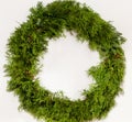 Traditional green Christmas wreath, white background