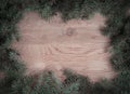 Traditional green Christmas wreath on wooden background