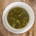 Traditional green dietary soup in a bowl