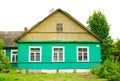 Traditional green and yellow wooden karaim house with three windows Royalty Free Stock Photo