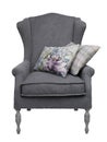 Traditional grey arm chair with floral and checkered cushions
