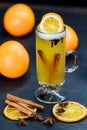 traditional grog drink with cinnamon sticks and orange