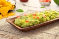 Traditional guacamole sauce with tortilla chips