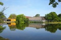 Traditional half timber building & yellow oche barn on the edge of a beautiful lake, Kvaerndrup, Funen, Denmark. Royalty Free Stock Photo