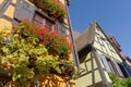 Facade of half timbered houses in Riquewihr village, France Royalty Free Stock Photo