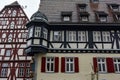 Traditional half-timbered houses on narrow medieval street in Rothenburg ob der Tauber, Bavaria, Germany. November 2014 Royalty Free Stock Photo