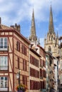 Traditional half-timbered houses and Sainte-Marie Cathedral. Bayonne, France Royalty Free Stock Photo