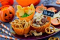 Traditional Halloween snack assortment on plate, treats for children in Halloween style