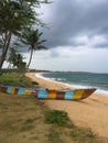 Fisherman boat piroga on the Indian ocean shore. Hambantota, Sri Lanka