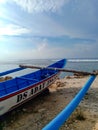 Fisherman boat piroga on the Indian ocean shore. Nusa dua, Bali, Indonesia