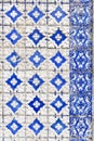 Traditional hand painted azulejos decorative tiles on a building in Porto