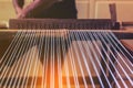 A traditional hand-weaving loom being used to make cloth Royalty Free Stock Photo