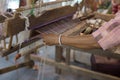 traditional hand-weaving loom being used to make cloth Royalty Free Stock Photo
