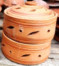 Traditional Handmade clay brown cups, pots and plates in Asian local market,Oriental bazaar. Old pottery. Exhibits ancient times Royalty Free Stock Photo