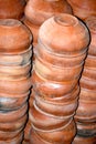 Traditional Handmade clay brown cups, pots and plates in Asian local market,Oriental bazaar. Old pottery. Exhibits ancient times Royalty Free Stock Photo